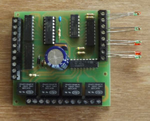detects operation of 4 solenoid point motors and operates LEDs as an indication and throws contacts which can be used for point frog switching or signal operation